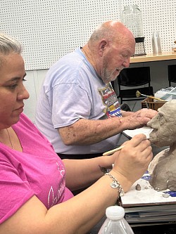 Adult Students Sculpt Clay Busts